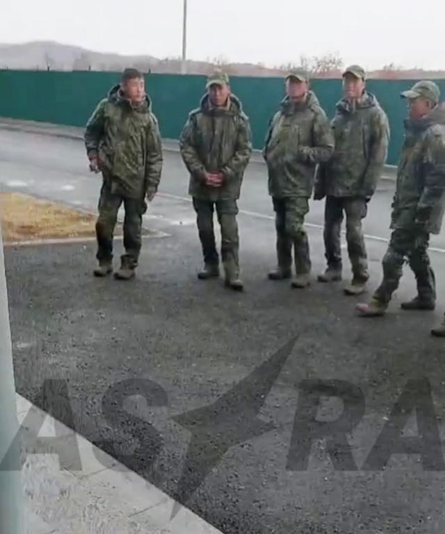 A group of soldiers believed to be North Koreans dispatched to Russia gathered at an unknown location in this grab from a video clip released by independent Russian media outlet Astra