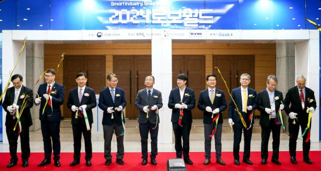 Officials participate in a tape-cutting ceremony at the opening of Robot World 2024 at KINTEX in Seoul on Oct 23 2024 AJP Kim Dong-woo