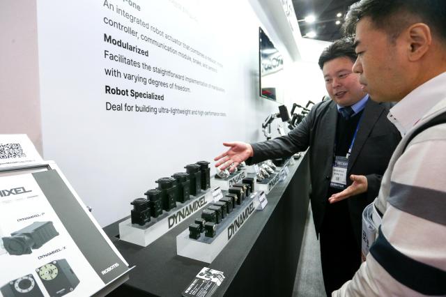 An exhibitor explains products to a visitor at Robot World 2024 at KINTEX in Seoul on Oct 23 2024 AJP Kim Dong-woo