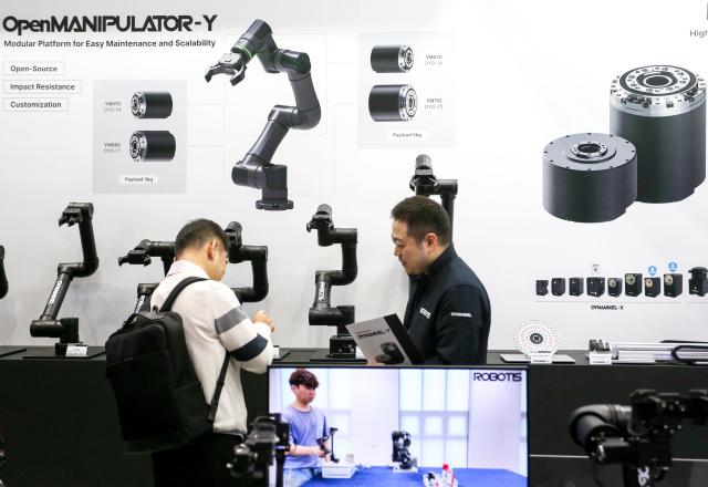 An exhibitor explains products to a visitor at Robot World 2024 at KINTEX in Seoul on Oct 23 2024 AJP Kim Dong-woo