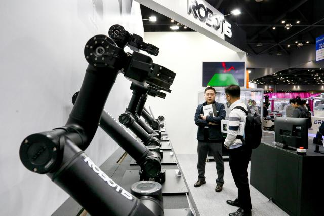 An exhibitor explains products to a visitor at Robot World 2024 at KINTEX in Seoul on Oct 23 2024 AJP Kim Dong-woo