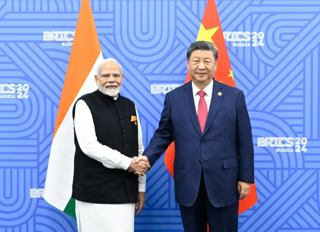 Chinese President Xi Jinping shakes hands with Indian Prime Minister Narendra Modi in Kazan Russia on Oct 23 2024 Xinhua-Yonhap