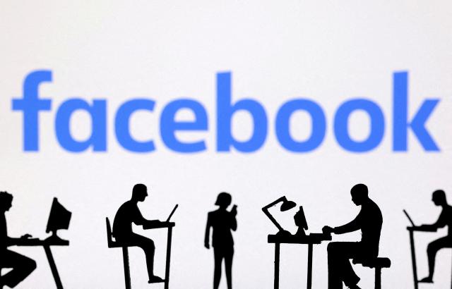 This illustration shows figurines with computers and smartphones below the Facebook logo Reuters-Yonhap