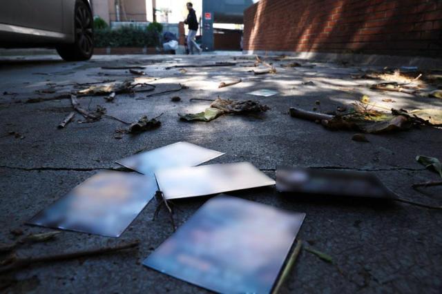 Propaganda leaflets from a trash-filled balloon sent by North Korea are scattered near the presidential office in Yongsan Seoul on Oct 24 2024 Yonhap