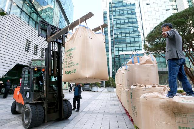 Farmers stack rice during a rally organized by the National Farmers Federation in Seoul on Oct 24 2024 AJP Kim Dong-woo