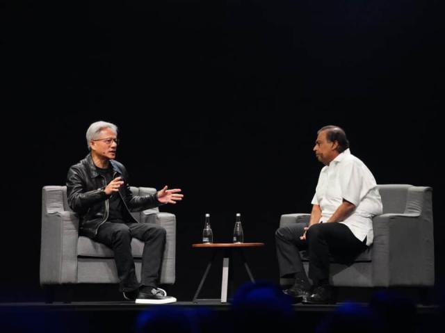 NVIDIA founder and CEO Jensen Huang speaking with Reliance Industries Chairman Mukesh Ambani at NVIDIA’s AI Summit in Mumbai Captured from Nvidias official website 
 