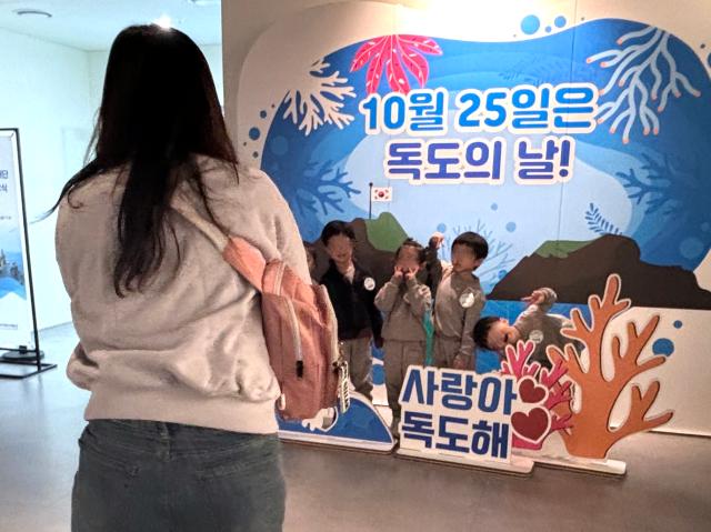 Children pose for photos at the Dokdo Museum Seoul Oct 25 2024 AJP Han Jun-gu