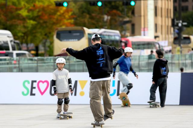 Visitors ride skateboards during the Seoul Extreme Sports Festival at Gwanghwamun Square in Seoul on Oct 25 2024 AJP Kim Dong-woo