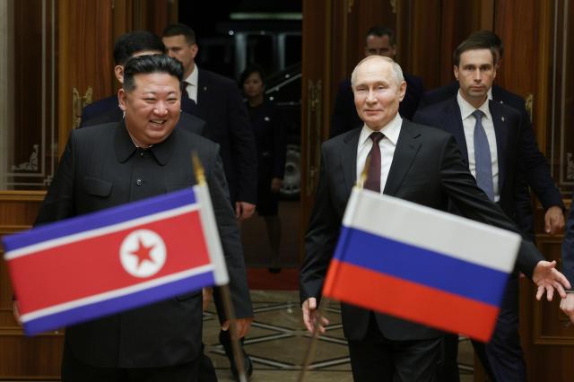 Russian President Vladimir Putin and North Korean leader Kim Jong-un smile during their meeting at the Pyongyang Sunan International Airport outside Pyongyang North Korea on June 19 2024 AP-Yonhap