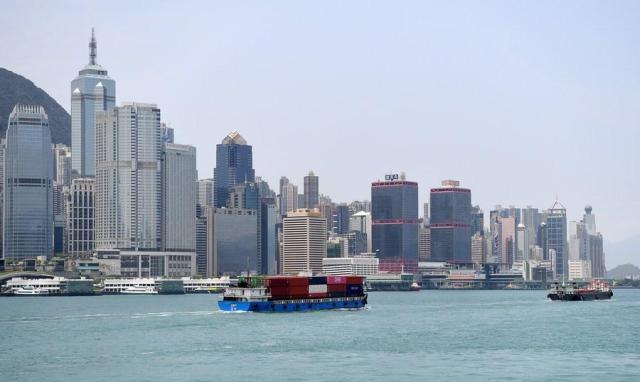 A container barge is seen in this picture of Victoria Harbour in Hong Kong south China taken in April 30 2023 Xinhua-Yonhap