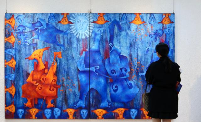 A visitor looks at works at an exhibition at the Latin American Cultural Center in Goyang Gyeonggi Province on Oct 24 2024 AJP Han Jun-gu