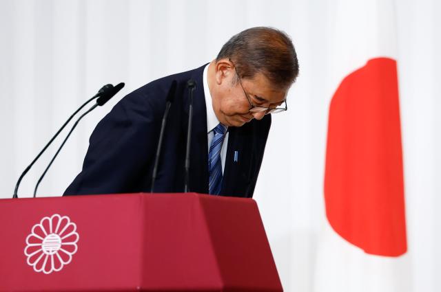 Japanese Prime Minister and head of the Liberal Democratic Party LDP Shigeru Ishiba bows to LDP lawmakers after a press conference at the partys headquarters in Tokyo Oct 28 2024