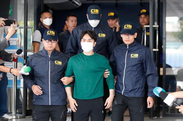 Thai founder and chief executive officer of the iCon Group Warathaphon Waratyaworrakul is taken by police officers to the Criminal Court after an investigation in Bangkok Thailand 18 Oct 2024 EPA-Yonhap