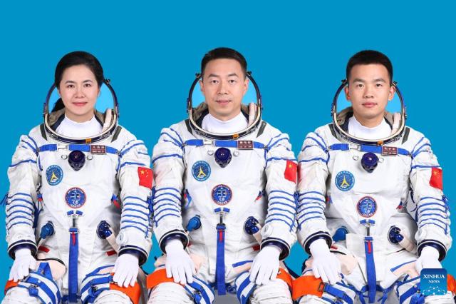 This photo features Chinese astronauts Cai Xuzhe center Song Lingdong right and Wang Haoze left who are set to undertake the Shenzhou-19 spaceflight mission Xinhua-Yonhap