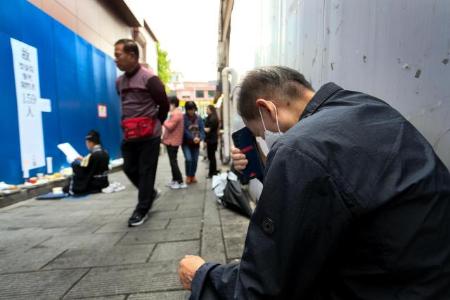 A visitor bows their head in grief at October 29 Memorial Alley in Seoul on Oct 29 2024 AJP Kim Dong-woo