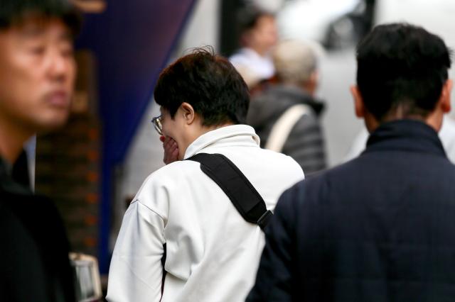 A visitor bows their head in grief at October 29 Memorial Alley in Seoul on Oct 29 2024 AJP Kim Dong-woo