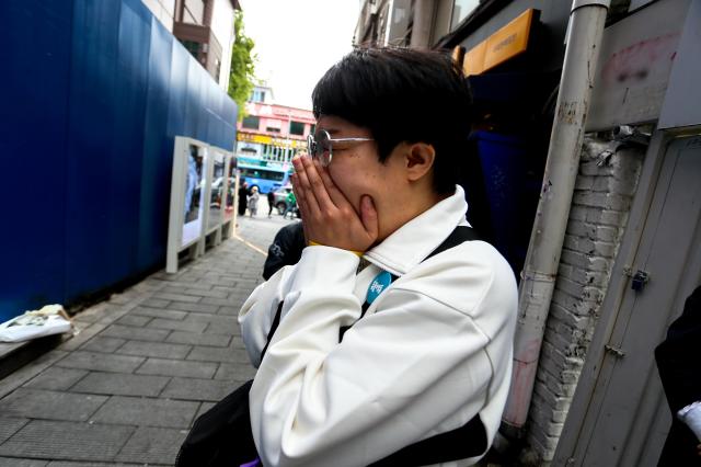 A visitor bows their head in grief at October 29 Memorial Alley in Seoul on Oct 29 2024 AJP Kim Dong-woo