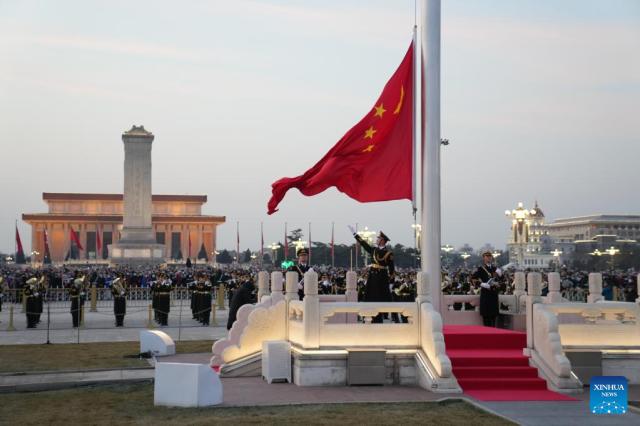 A national flag-raising ceremony takes place at Tiananmen Square in Beijing China on Jan1 2022 Xinhua-Yonhap