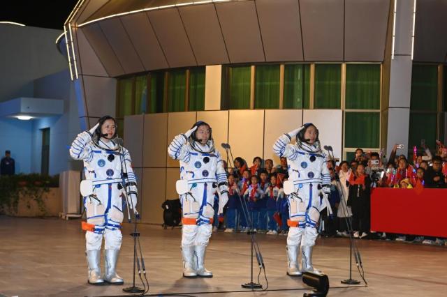 Chinese astronauts Cai Xuzhe center Song Lingdong right and Wang Haoze left attend a send-off ceremony at the Jiuquan Satellite Launch Center in northwest China on Oct30 2024 Xinhua-Yonhap