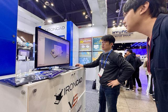 A visitor looks at exhibits at the Asia Machinery  Manufacturing Exhibition AMXPO at KINTEX in Goyang Gyeonggi Province on Oct 31 2024 AJP Kim Dong-woo