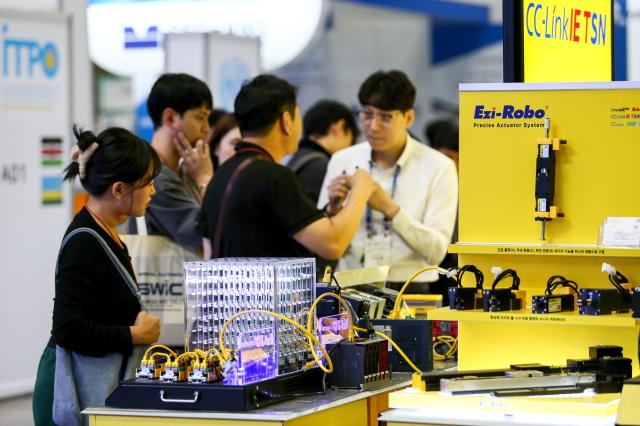 A visitor looks at exhibits at the Asia Machinery  Manufacturing Exhibition AMXPO at KINTEX in Goyang Gyeonggi Province on Oct 31 2024 AJP Kim Dong-woo