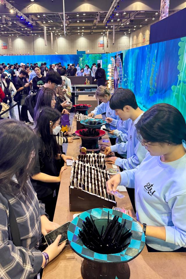 Visitors participate in booth events at Welcome to Hoyoland at KINTEX in Goyang Gyeonggi Province on Oct 31 2024 AJP Kim Dong-woo