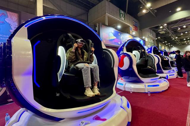 Visitors participate in booth events at Welcome to Hoyoland at KINTEX in Goyang Gyeonggi Province on Oct 31 2024 AJP Kim Dong-woo