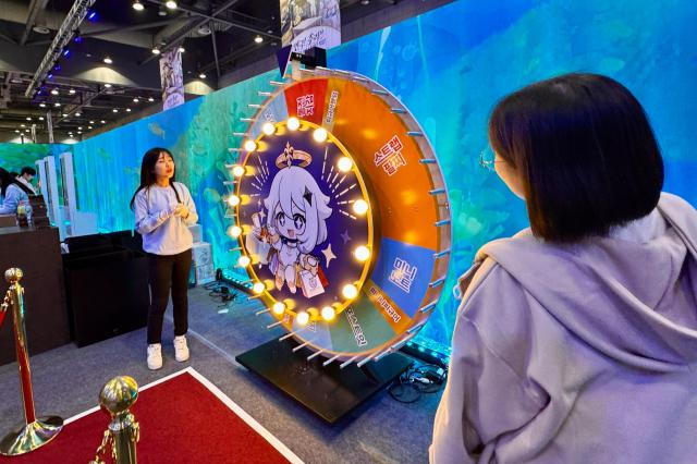 Visitors participate in booth events at Welcome to Hoyoland at KINTEX in Goyang Gyeonggi Province on Oct 31 2024 AJP Kim Dong-woo