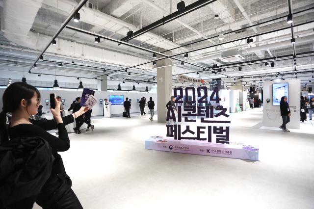 A visitor takes a photo at the AI Content Festival 2024 at COEX Seoul on Oct 31 2024 AJP Han Jun-gu