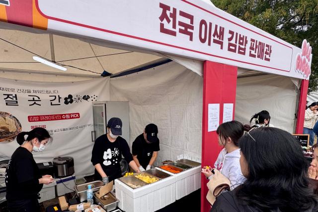 Visitors line up to buy gimbap at the World Gimbap Festival 2024 at Yeouido Hangang Park in Seoul on Nov 1 2024 AJP Kim Dong-woo