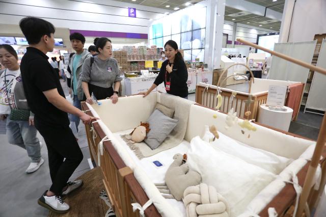 Visitors browse baby products at the Cobe Baby Fair at COEX in Seoul Oct 31 2024 AJP Han Jun-gu