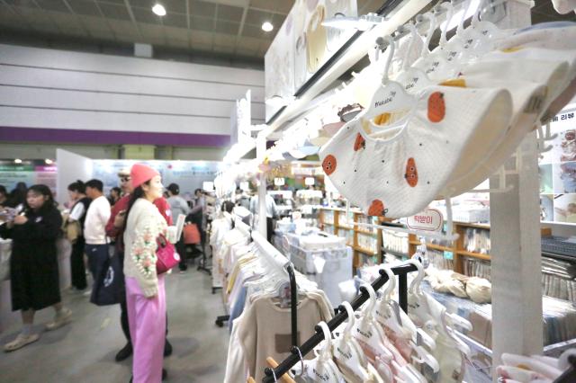 Visitors browse baby products at the Cobe Baby Fair at COEX in Seoul Oct 31 2024 AJP Han Jun-gu