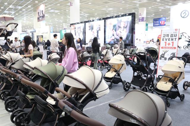 Visitors browse baby products at the Cobe Baby Fair at COEX in Seoul Oct 31 2024 AJP Han Jun-gu