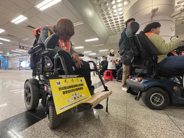 Members of Solidarity Against Disability Discrimination stage a performance at National assembly station in Seoul Oct 29 2024 AJP Han Jun-gu