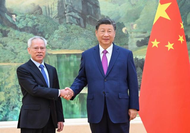 President Xi Jinping shakes hands with Sam Hou Fai the newly elected chief executive of the Macao Special Administrative Region at the Great Hall of the People in Beijing China on Nov 1 2024  Xinhua-Yonhap