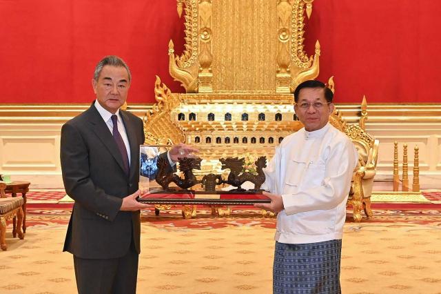 Myanmar junta chief Min Aung Hlaing meets Chinese Foreign Minister Wang Yi in Naypyidaw Aug 14 2024 AFP-Yonhap