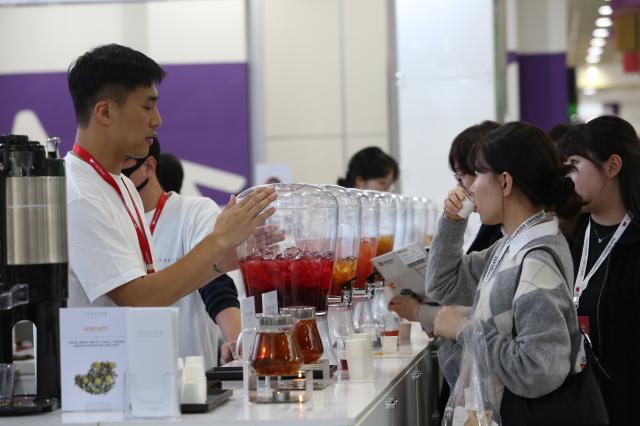 A visitor tastes samples at Cafe Show Seoul at COEX in Seoul on Nov 6 2024 AJP Han Jun-gu