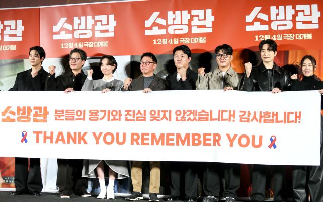 From left Actors Jang Young-nam Lee Jun-hyuk Oh Dae-hwan Kim Min-jae director Kwak Gyeong-Taek Lee Yoo-young Kwak Do-won and Joo Won pose for a photo during a press conference for The Firefighters at CGV IPark Mall in Yongsan-gu Seoul on Nov 8 2024 AJP Kim Dong-woo