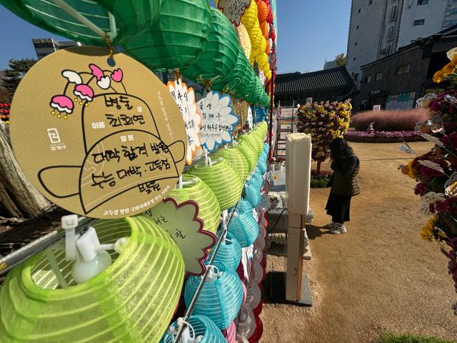 A visitor prays for students success on the College Scholastic Ability Test at Jogyesa Temple in Seoul Nov 11 2024  AJP Han Jun-gu