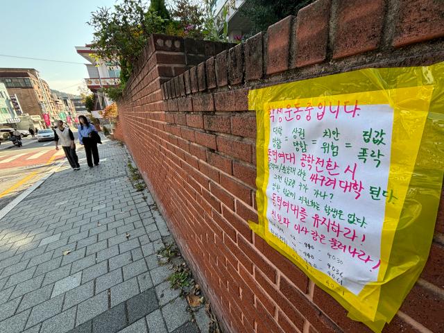 Messages opposing co-education plans appear on the walls at Dongduk Womens University in Seoul Nov 13 2024 AJP Han Jun-gu