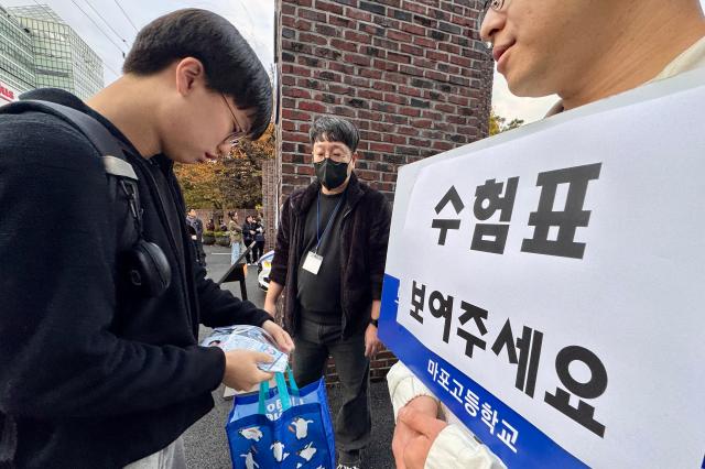 Students enter Mapo High School to take the College Scholastic Ability Test CSAT in Seoul Nov 14 2024  AJP Kim Dong-woo