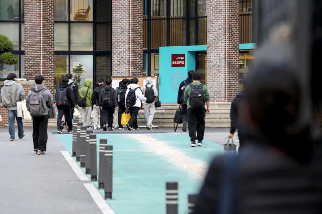 Students enter Mapo High School to take the College Scholastic Ability Test CSAT in Seoul Nov 14 2024  AJP Kim Dong-woo