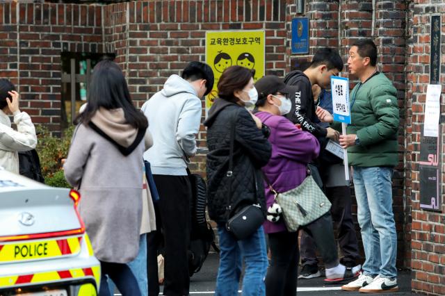 Students enter Mapo High School to take the College Scholastic Ability Test CSAT in Seoul Nov 14 2024  AJP Kim Dong-woo