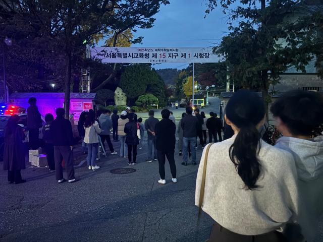 Parents gather outside a test venue in Seoul on Nov 14 2024 waiting for their children to come out after the annual university entrance exam AJP Han Jun-gu