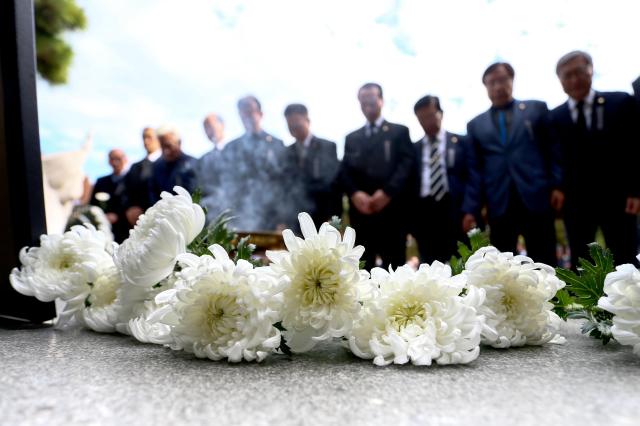 Attendees lay flower tributes during a memorial ceremony for independence activists at Seoul National Cemetery in Seoul on Nov 15 2024 AJP Kim Dong-woo