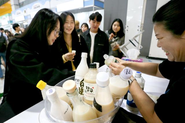 Visitors sample traditional Korean liquors at the Korean Sool Grand Festival 2024 at aT Center in Seoul on Nov 15 2024 AJP Kim Dong-woo