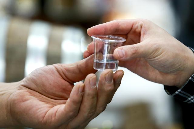 An exhibitor serves traditional Korean liquor to a visitor at the Korean Sool Grand Festival 2024 at aT Center in Seoul on Nov 15 2024 AJP Kim Dong-woo