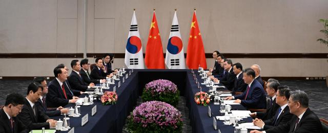 South Korean President Yoon Suk Yeol 4th from left and Chinese President Xi Jinping 4th from right hold a summit in Lima on Nov 15 2024 Yonhap