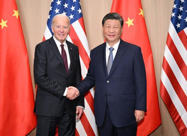 Chinese President Xi Jinping shakes hands with US President Joe Biden in Lima Peru Nov 16 2024 Xinhua-Yonhap