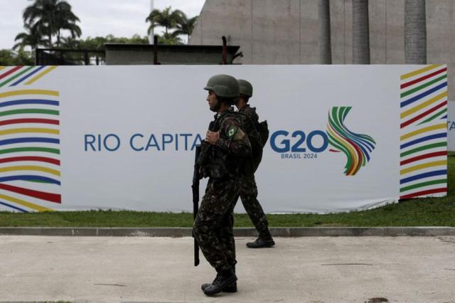 Soldiers patrol the perimeters of the Museum of Modern Art the host venue for the upcoming G20 summit in Rio de Janeiro on Nov 14 2024 AP-Yonhap